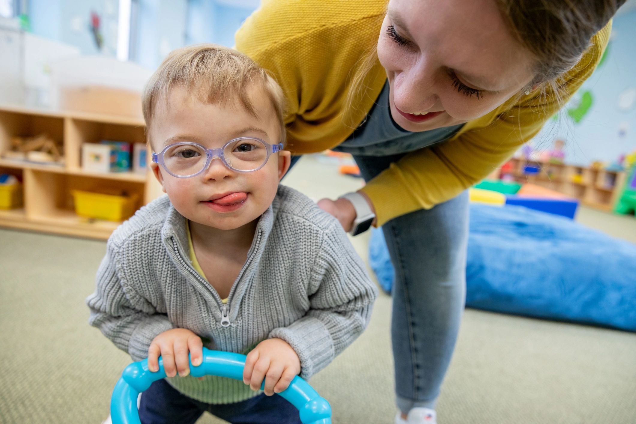 caregiver helping child with activity
